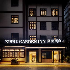 Xishu Garden Inn - Travel Agency Service - Car Rent Service - English Speaking